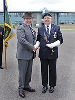 Our Standard Bearer, Ben Revell, being presented with the 3rd prize in the Standard Bearers competition, by the Master of Signals, Lieut Gen Robert Baxter.